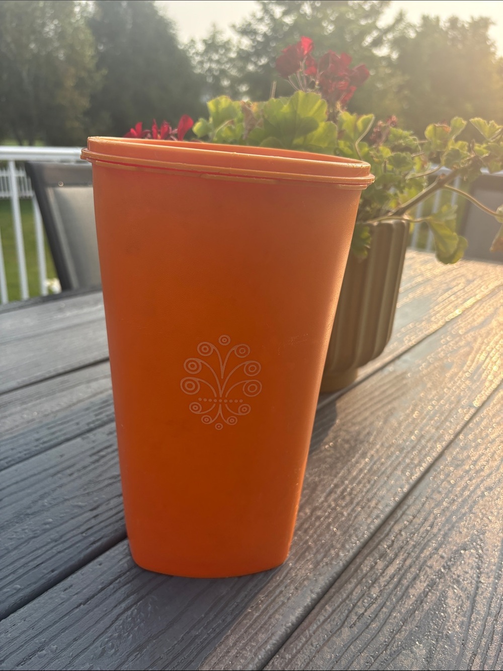 Tupperware Orange Storage Container with Decorative Emblem